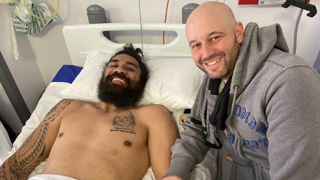 Mose Masoe is visited in hospital by NRL boss Todd Greenberg.