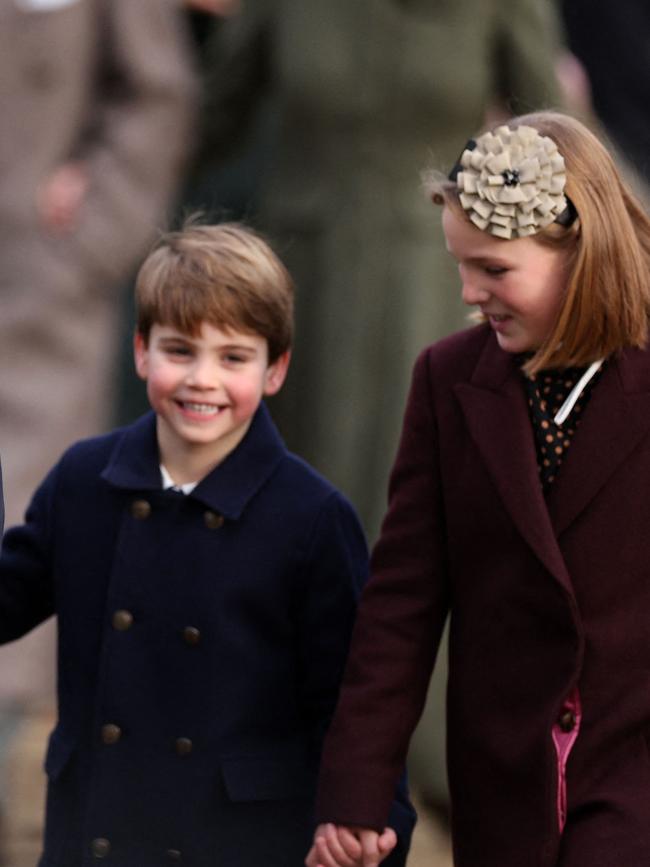 The pair found plenty to giggle about as they followed King Charles and Queen Camilla down the path near Mary Magdalene Church. Picture: AFP