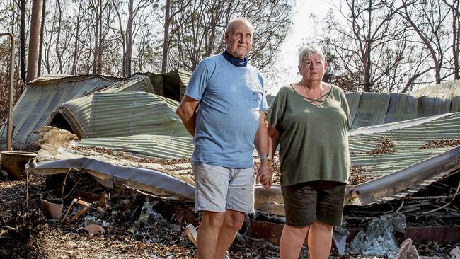 Stewart and Pamela Skeen in the ruins of their house in the aftermath of the fire. Picture: Jerad Williams