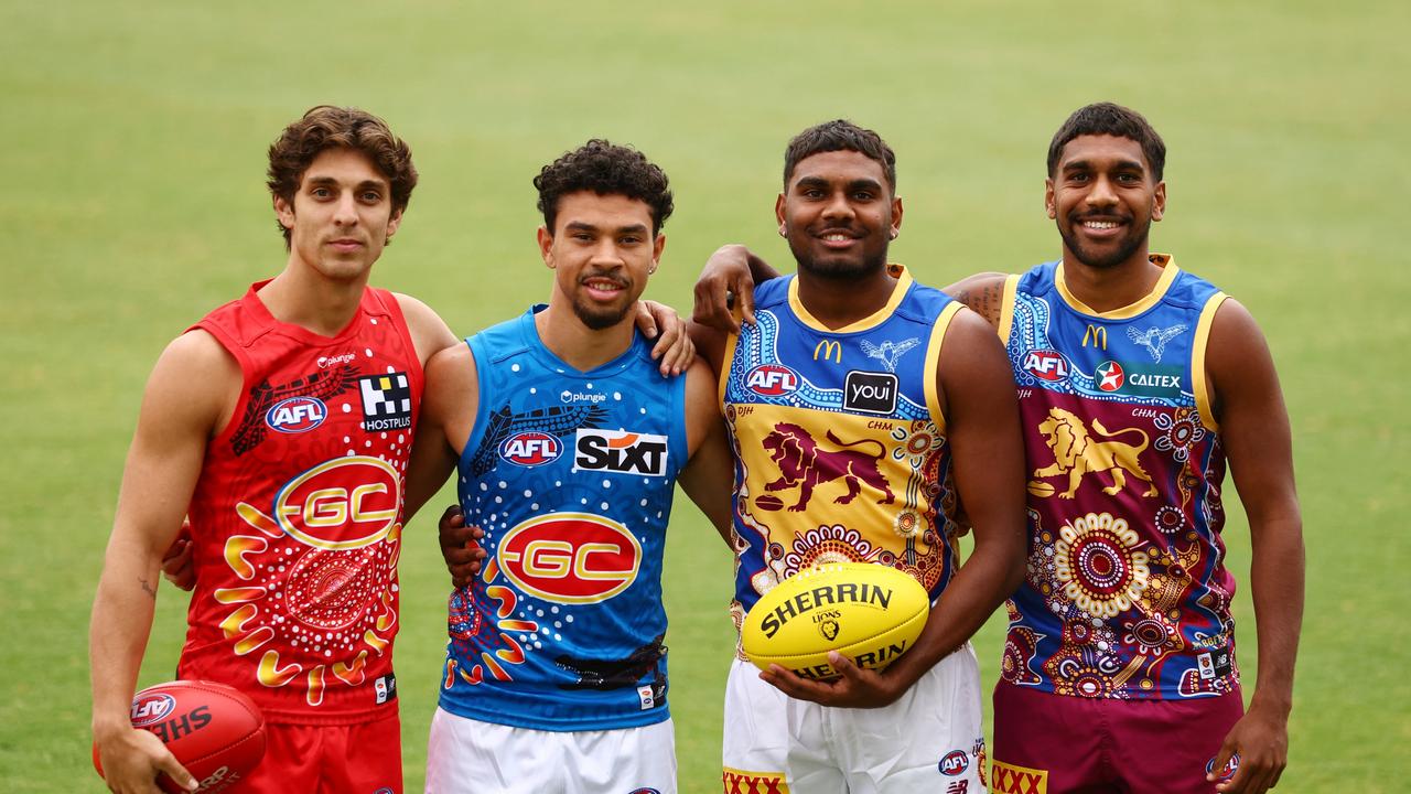 Proudly wearing their club’s Indigenous guernseys are (from left) Gold Coast Suns pair Sean Lemmens and Malcolm Rosas Jnr and Brisbane Lions pair Blake Coleman and Keidean Coleman. Picture: Chris Hyde/Getty Images