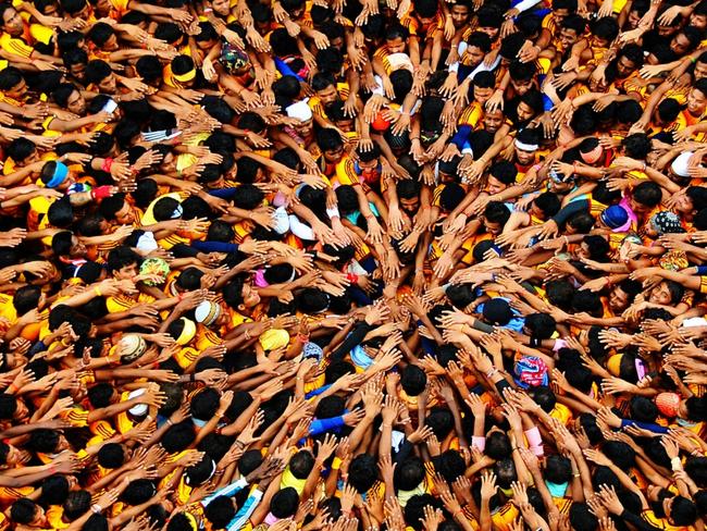 Govinda players gather together under Dahi Handi to make a human pyramid in order to catch and then break an earthen pot high in the air with the help of a rope, to win prizes. Picture: Money Sharma/2019 Drone Awards