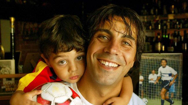 Adelaide United’s inaugural A-League captain Ross Aloisi with son Christian, then aged 2, in 2004.