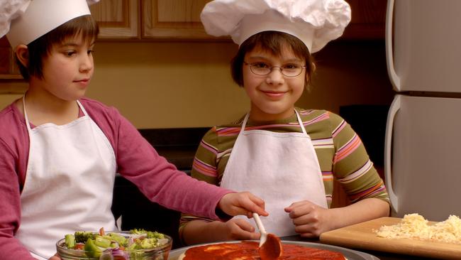 Children making pizza. Thinkstock