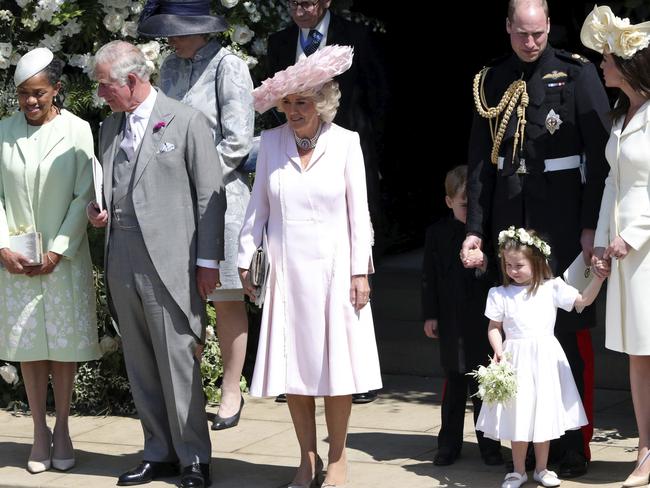 Doria Ragland, the Prince of Wales, the Duchess of Cornwall, the Duke and Duchess of Cambridge with Prince George and Princess Charlotte leave after the wedding. Picture: AP