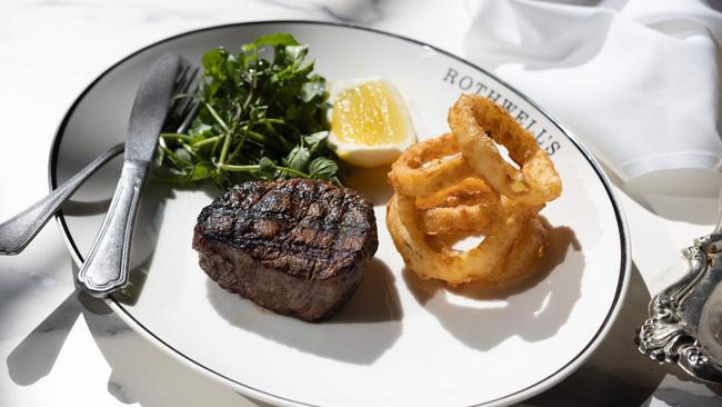 The grain-fed eye fillet steak with onion rings.