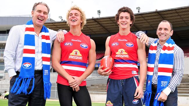 Former Dogs Steve Wallis and Tony Liberatore with sons Mitch and Tom after they were drafted.