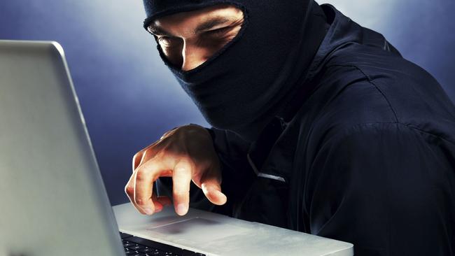 Computer hacker - Male thief stealing data from laptop