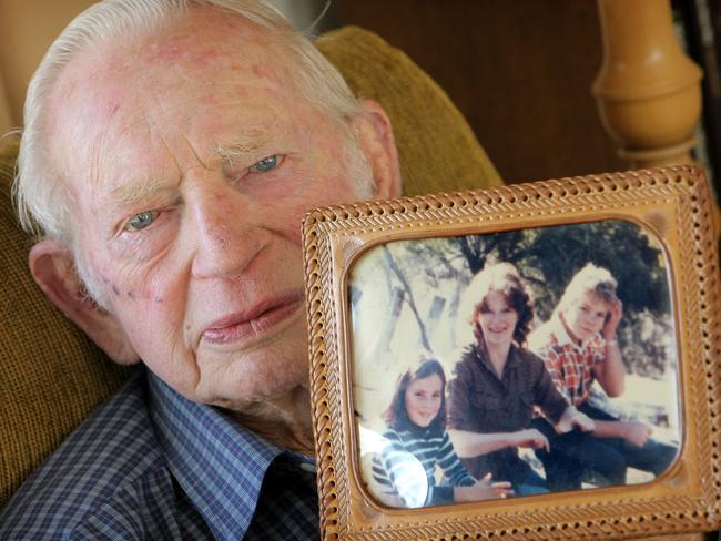 Alan Nelson with a photograph of his murdered daughter Margaret Tapp, his granddaughter Seana Tapp, 9, and grandson Justin. Margaret and Seana were murdered in 1984 in what is still an unsolved cold case.