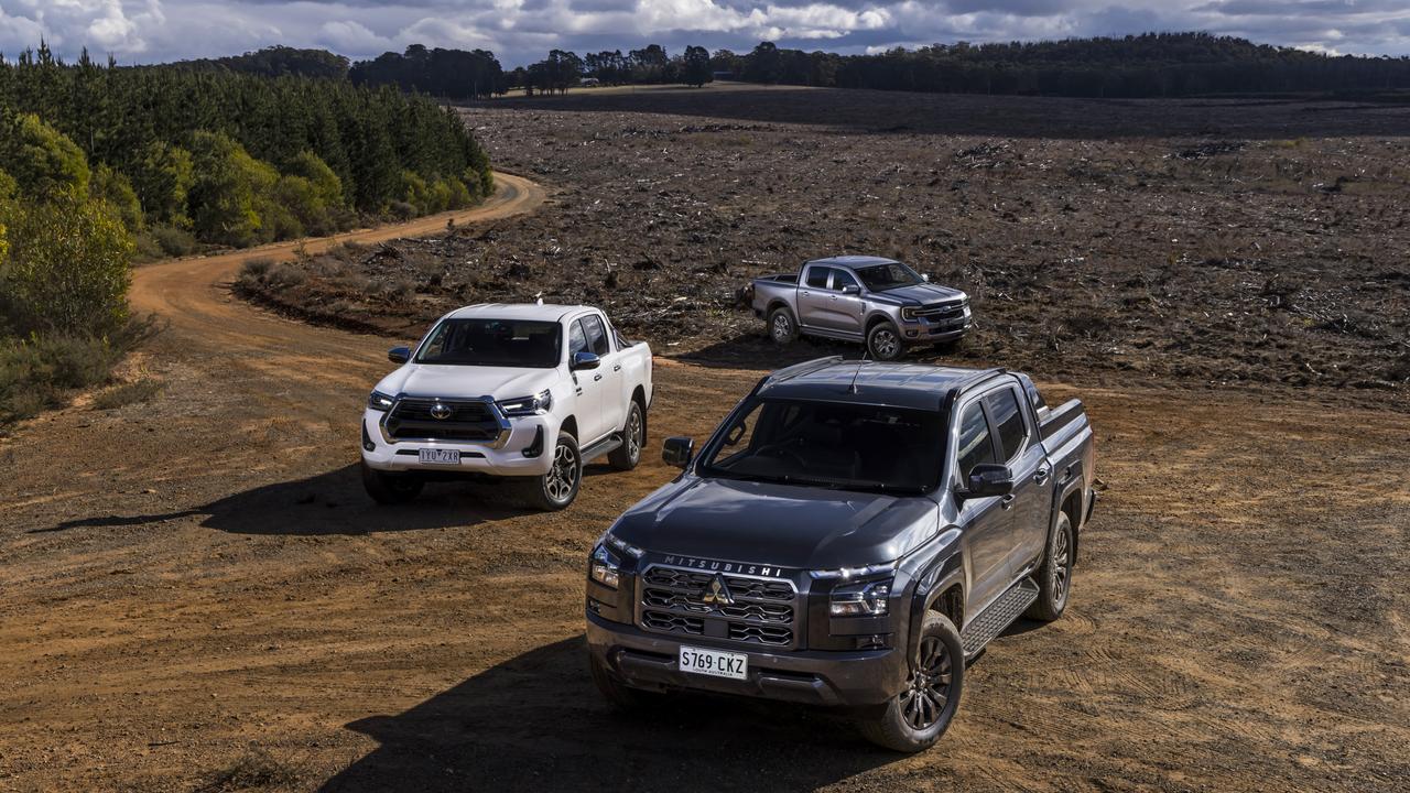 Mitsubishi Triton (front), Toyota HiLux (left) and Ford Ranger utes. Photo: Mark Bean.