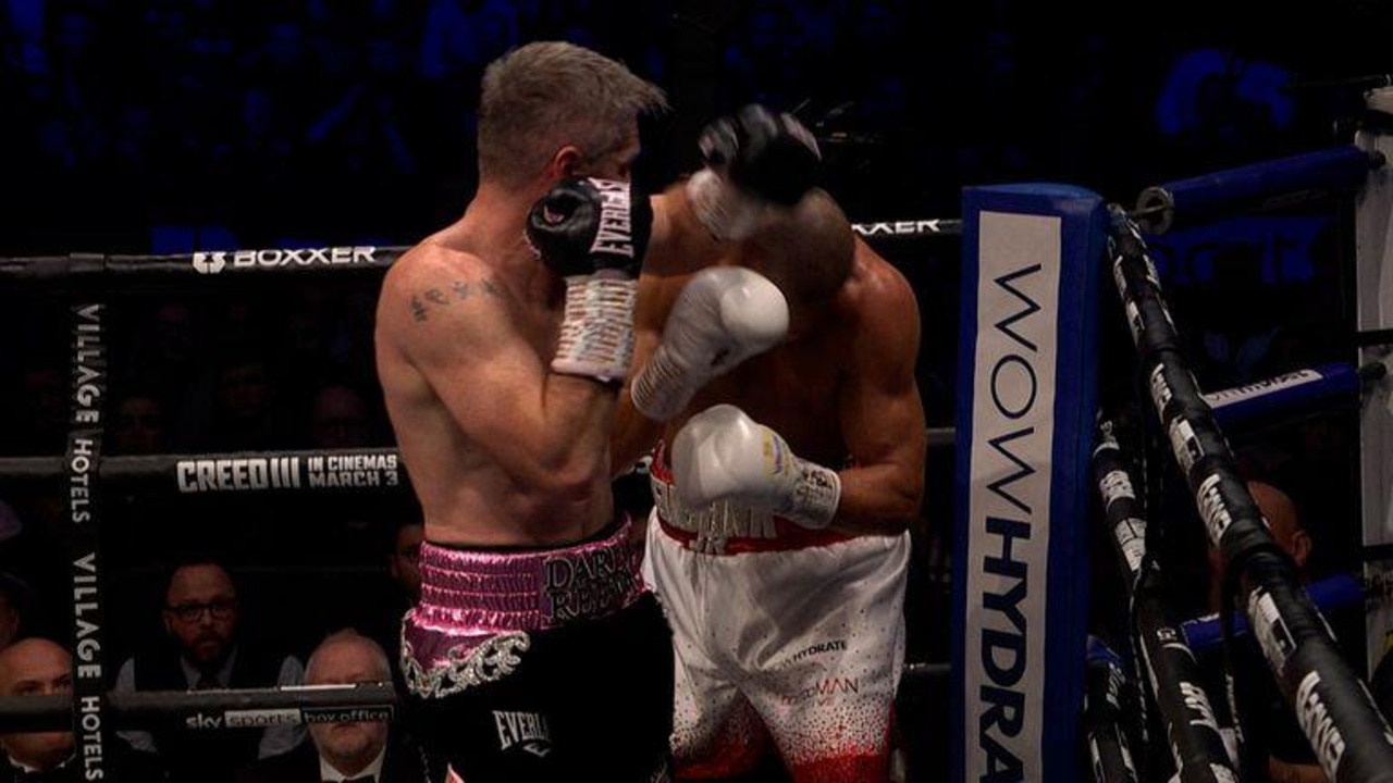 Liam Smith appears to catch the side of Eubank Jr's head with an illegal elbow.