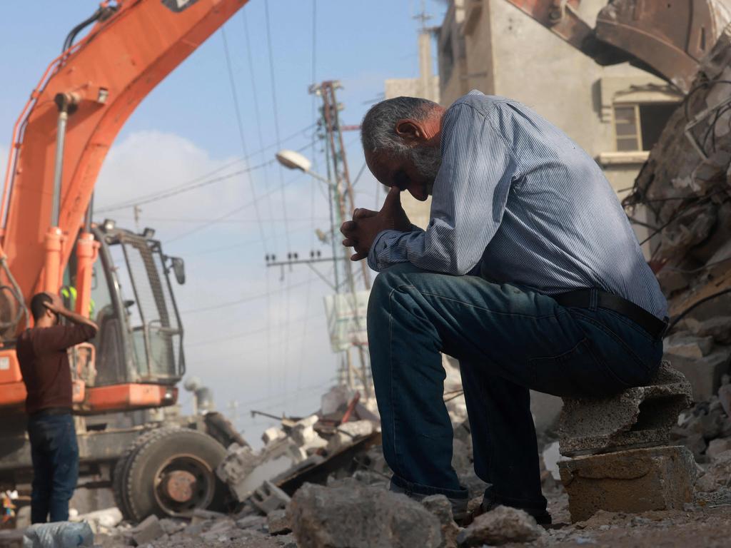 A Palestinian man waits for news of his daughter as rescue workers search for survivors under the rubble of a building hit in an overnight Israeli strike in Rafah. Picture: Mohammed Abed/AFP