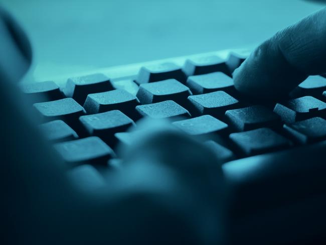 Hands typing on desktop pc computer keyboard