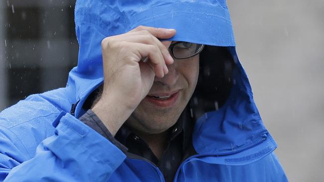 Subway restaurant spokesman Jared Fogle walks to a waiting car as he leaves his home, Tuesday, July 7, 2015, in Zionsville, Ind. FBI agents and Indiana State Police have removed electronics from the property. FBI Special agent Wendy Osborne said that the FBI was conducting an investigation in the Zionsville area but wouldn't confirm it involved Fogle. (AP Photo/Michael Conroy)