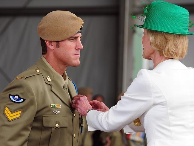 The Governor-General, Her Excellency Ms Quentin Bryce, awards the Victoria Cross for Australia to Australian Army soldier Corporal Benjamin Roberts-Smith, VC, MG, at Campbell Barracks, Perth, on 23 January 2011. *** Local Caption *** The Governor-General of the Commonwealth of Australia held an investiture ceremony at Campbell Barracks in Perth to award a Victoria Cross for Australia to Corporal Benjamin Roberts-Smith, VC, MG, on 23 January 2011.  Corporal Benjamin Roberts-Smith, VC, MG, from the Special Air Service Regiment was awarded the Victoria Cross for Australia for his gallantry under fire during operations in Afghanistan in June 2010.    Present at the ceremony were the Governor-General of the Commonwealth of Australia, Her Excellency Ms Quentin Bryce AC; Prime Minister of Australia the Hon. Julia Gillard MP; Leader of the Opposition the Hon. Tony Abbott MP; Minister for Defence the Hon. Stephen Smith MP; Minister for Defence Science and Personnel the Hon Warren Snowdon MP; Governor of Western Australia, His Excellency Dr Ken Michael AC; Premier of Western Australia the Hon. Colin Barnett MLA; Ambassador of the Islamic Republic of Afghanistan, his Excellency Dr Amanullah Jayhoon; Member for Curtin the Hon. Julie Bishop MP; Chief of the Defence Force, Air Chief Marshal Angus Houston AC AFC; Chief of Army, Lieutenant General Ken Gillespie AO DSC CSM; and Special Operations Commander Australia, Major General Gus Gilmore DSC.  The Victoria Cross for Australia is our highest honour. It is only awarded to those who display the most conspicuous gallantry and daring in the face of the enemy. Corporal Benjamin Roberts-Smith, VC, MG, becomes the 98th Australian recipient of the award and the second recipient of the Victoria Cross for Australia since it was instituted in 1991. Picture: Department of Defence