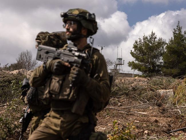 Israeli troops patrolling near a United Nations Interim Force In Lebanon (UNIFIL) base in the southern Lebanon's Naqoura region near the border. UN peacekeepers in Lebanon said Israeli tanks broke through a gate to enter a Blue Helmet position in Lebanon. Picture: AFP