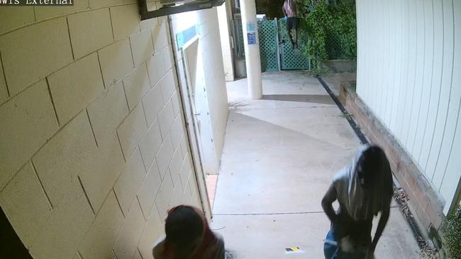 Culprits jump over a fence to find the best way into the Katherine Country Club on the early hours of Monday morning. Picture: Supplied