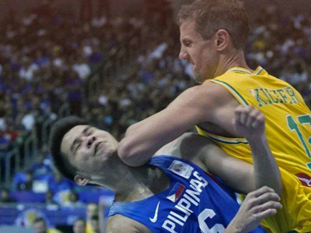 Daniel Kickert of Australia elbows Roger Pogoy of the Philippines during the FIBA Basketball World Cup 2019 Group B qualifier match between the Philippines and Australia in Manila, Philippines, 02 July 2018. Picture: Supplied/ FIBA Telecast