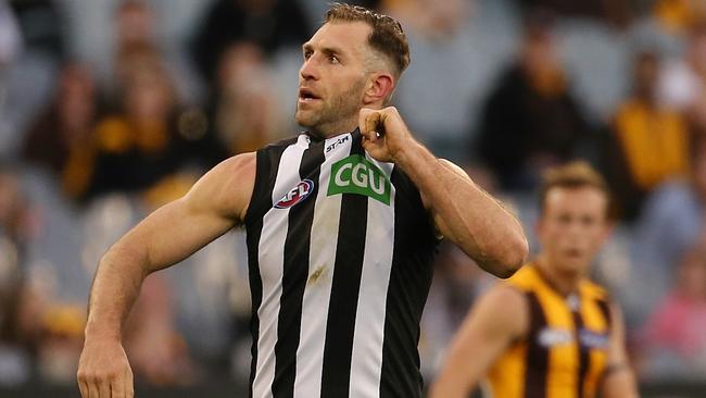 Travis Cloke pulls his Collingwood jumper after kicking a goal. Picture: Wayne Ludbey