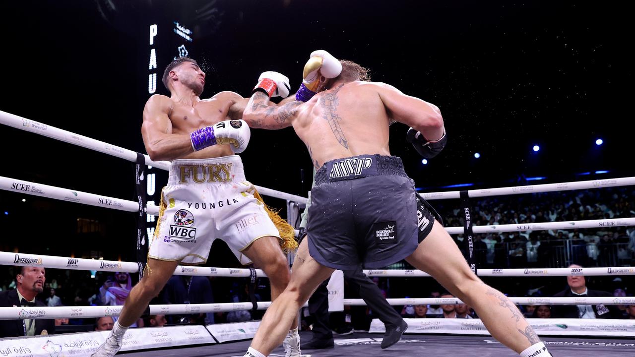 Tommy Fury leans on the ropes after Jake Paul lands a punch. Photo by Francois Nel/Getty Images.