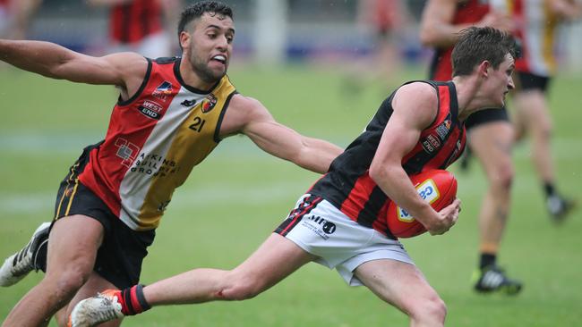 Goodwood’s Nick Favretto, who has been one of the league’s best performing midfielders, pursues Rostrevor’s Anthony McCarthy during last year’s grand final. Picture: Dean Martin