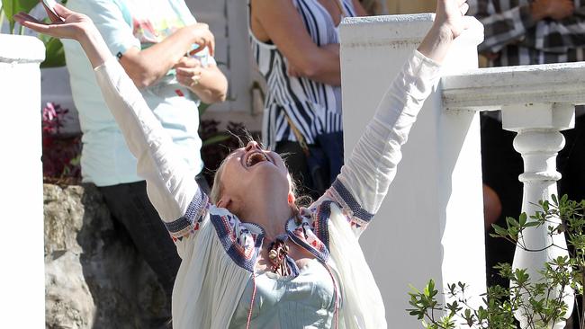 The winning bidder celebrates securing a hotly contested property in Pittwater Rd, North Manly on Saturday. Picture: Troy Snook