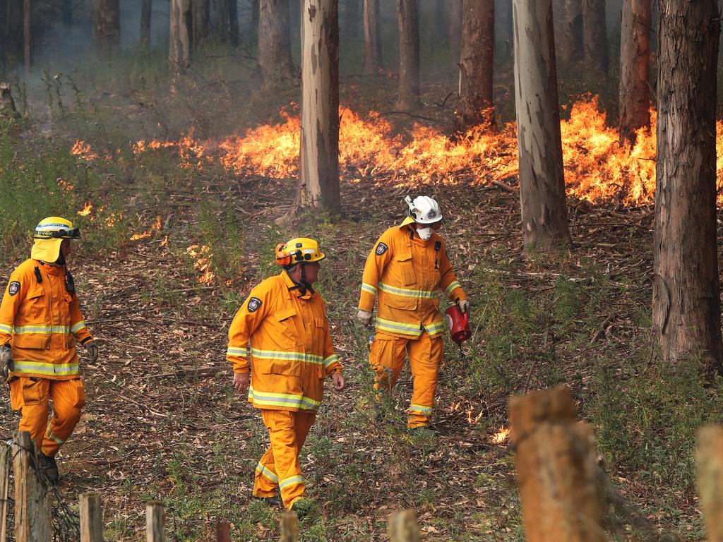 January 2019 Tasmanian Bushfires. Kingston Fire Brigade members putting in a controlled fire break behind a home on Donnellys Rd, Geeveston, in the Huon Valley. Picture: NIKKI DAVIS-JONES