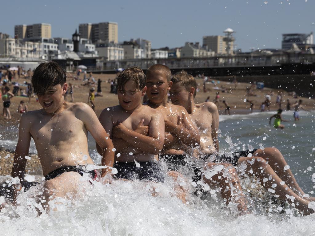 Young boys enjoy the sun in England as the temperature soars to 34. Picture: Dan Kitwood/Getty Images