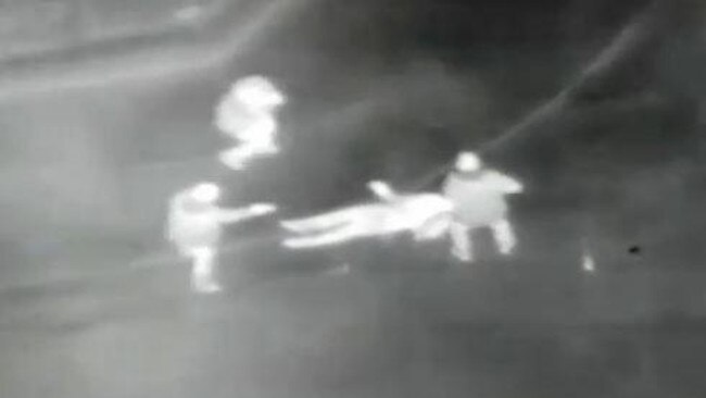 Police chopper footage shows officers standing around Moore as he was being tasered.