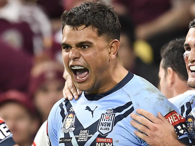 TOWNSVILLE, AUSTRALIA - JUNE 09:  Latrell Mitchell of the Blues celebrates with team mates after scoring a try during game one of the 2021 State of Origin series between the New South Wales Blues and the Queensland Maroons at Queensland Country Bank Stadium on June 09, 2021 in Townsville, Australia. (Photo by Ian Hitchcock/Getty Images)