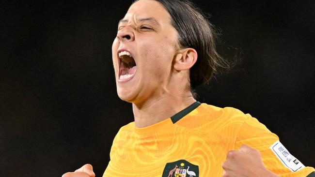 FILES-- This file photo taken on August 16, 2023 shows Australia's forward Sam Kerr celebrating scoring her team's first goal during the Australia and New Zealand 2023 Women's World Cup semi-final football match between Australia and England at Stadium Australia in Sydney. Chelsea and Australian women's football star Sam Kerr has been charged with a "racially aggravated offence" in Britain following a dispute involving a police officer, London's Metropolitan Police said March 4. The 30-year-old striker, one of the highest profile and best-paid players in the women's game, was charged following an incident in London in January 2023, a police statement read. (Photo by IZHAR KHAN / AFP)