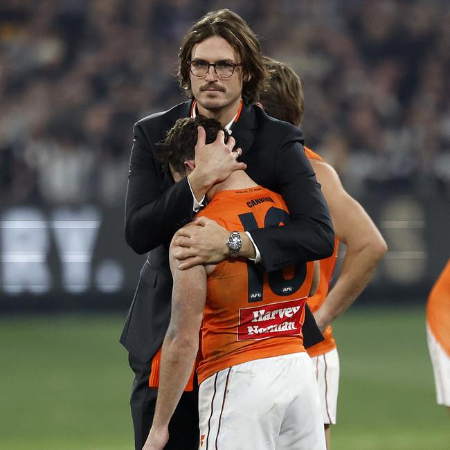 Daniels was consoled by his former captain, retiring GWS defender Phil Davis, after the one-point preliminary final loss. Picture: Phil Hillyard