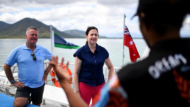 Premier Annastacia Palaszczuk and the Member for Cairns Michael Healy talk to an indigenous crew member onboard a reef cruise boat during a visit to Fitzroy Island, while on the election campaign trail. Picture: NCA NewsWire / Dan Peled