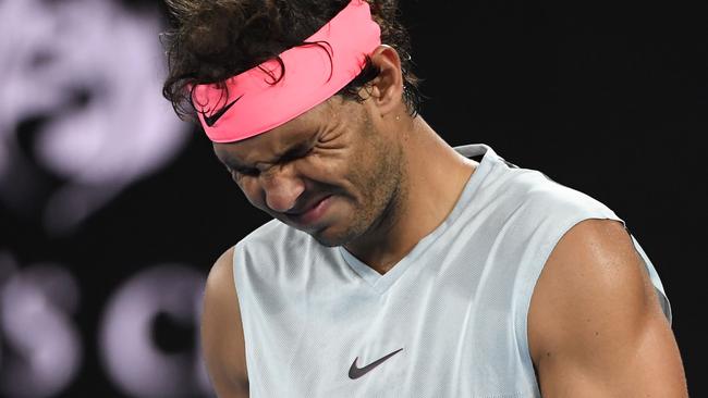 Petty in pink: Rafael Nadal psyches himself up for the mother of all whinges. Picture: AFP