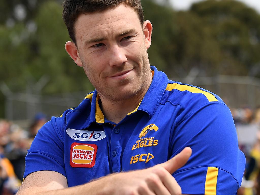 Jeremy McGovern gives a thumbs up to Eagles fans in the Grand Final parade.