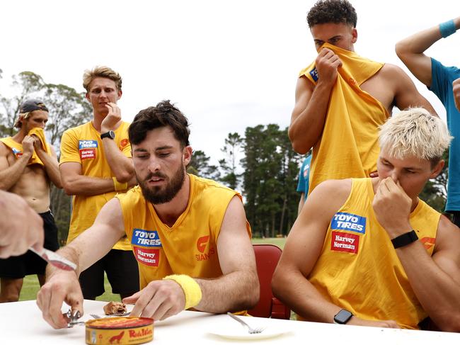 Hamilton and Lachie Ash during a food-eating challenge on a pre-season camp.