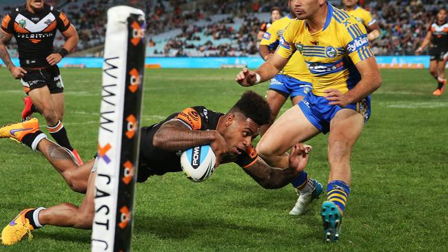 Kevin Naiqama dives over for one of his two tries.