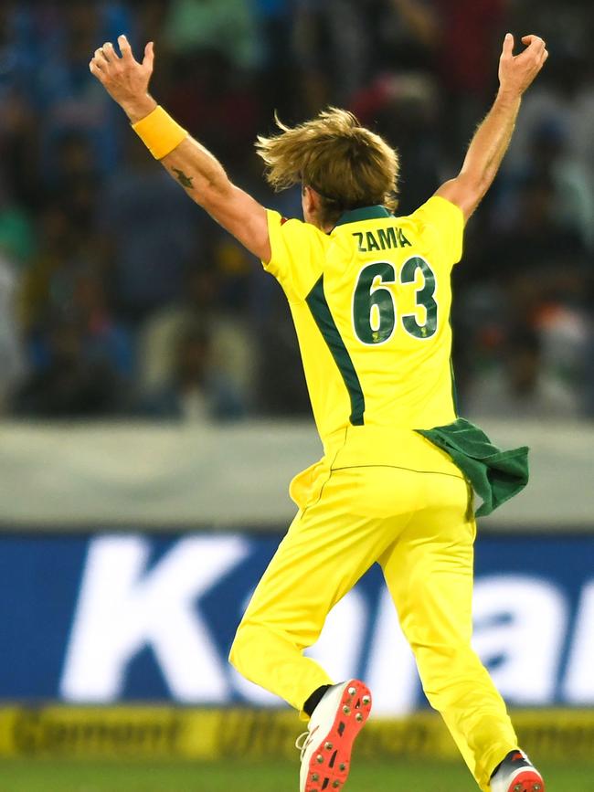 Australian bowler Adam Zampa reacts after snaring the wicket of Virat Kohli.