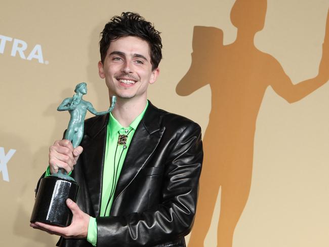 US-French actor Timothee Chalamet poses in the press room with the award for Outstanding Performance by a Male Actor in a Leading Role in a Motion Picture for "A Complete Unknown" during the 31st Annual Screen Actors Guild awards at the Shrine Auditorium in Los Angeles, February 23, 2025. (Photo by VALERIE MACON / AFP)