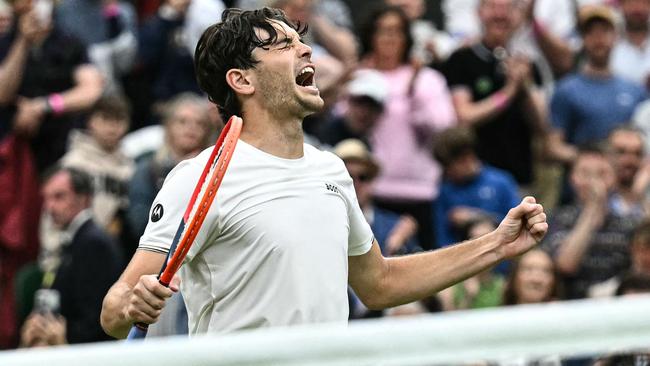 Fritz roars in delight after his thrilling comeback win over Alexander Zverev. (Photo by Ben Stansall / AFP)