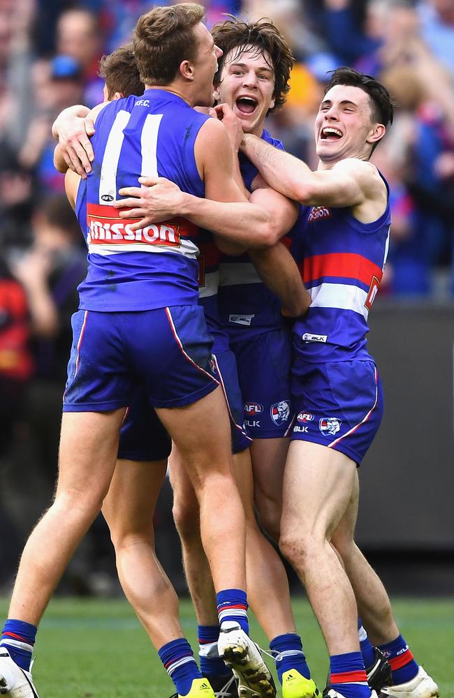 Macrae with teammates Josh Dunkley, Liam Picken and Toby McLean start the Grand Final celebrations. Picture: Getty Images