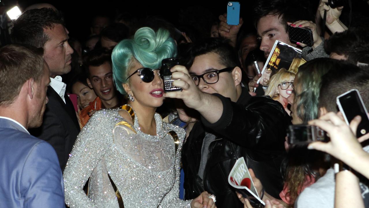 Singer Lady Gaga arrives at The Park Hyatt Hotel in The Rocks, Sydney, to be greeted by scores of fans in 2012. Picture: Noel Kessel
