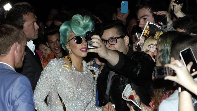 Singer Lady Gaga arrives at The Park Hyatt Hotel in The Rocks, Sydney, to be greeted by scores of fans in 2012. Picture: Noel Kessel