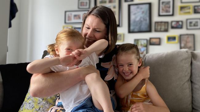 Lotus Consulting founder Sian Burton with children Lola, 2, and Eva, 6, at their Semaphore home. Picture: Brinley Duggan