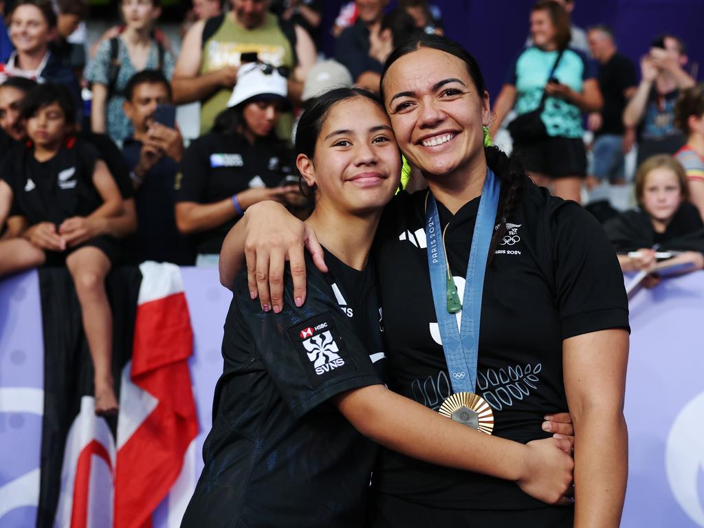 Gold medallist from Team New Zealand Stacey Waaka (right) poses with a family member after the Women's Rugby Sevens medal ceremony. Picture: Getty Images