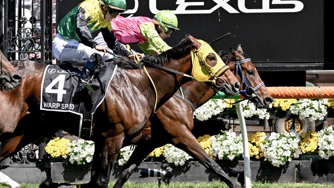 Knight's Choice ridden by Irish jockey Robbie Dolan hits the line to win ahead of Japanese horse Warp Speed ridden by jockey Akira Sugawara. Photo by William WEST / AFP.