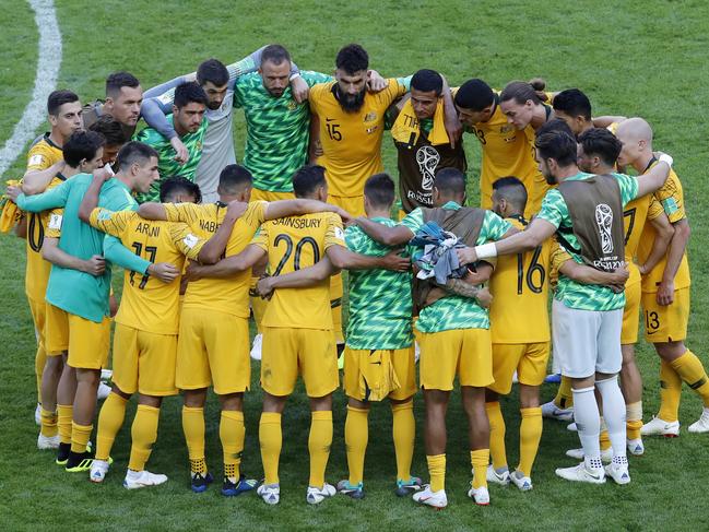 Jedinak talks to the team after the loss to France. Picture: AP