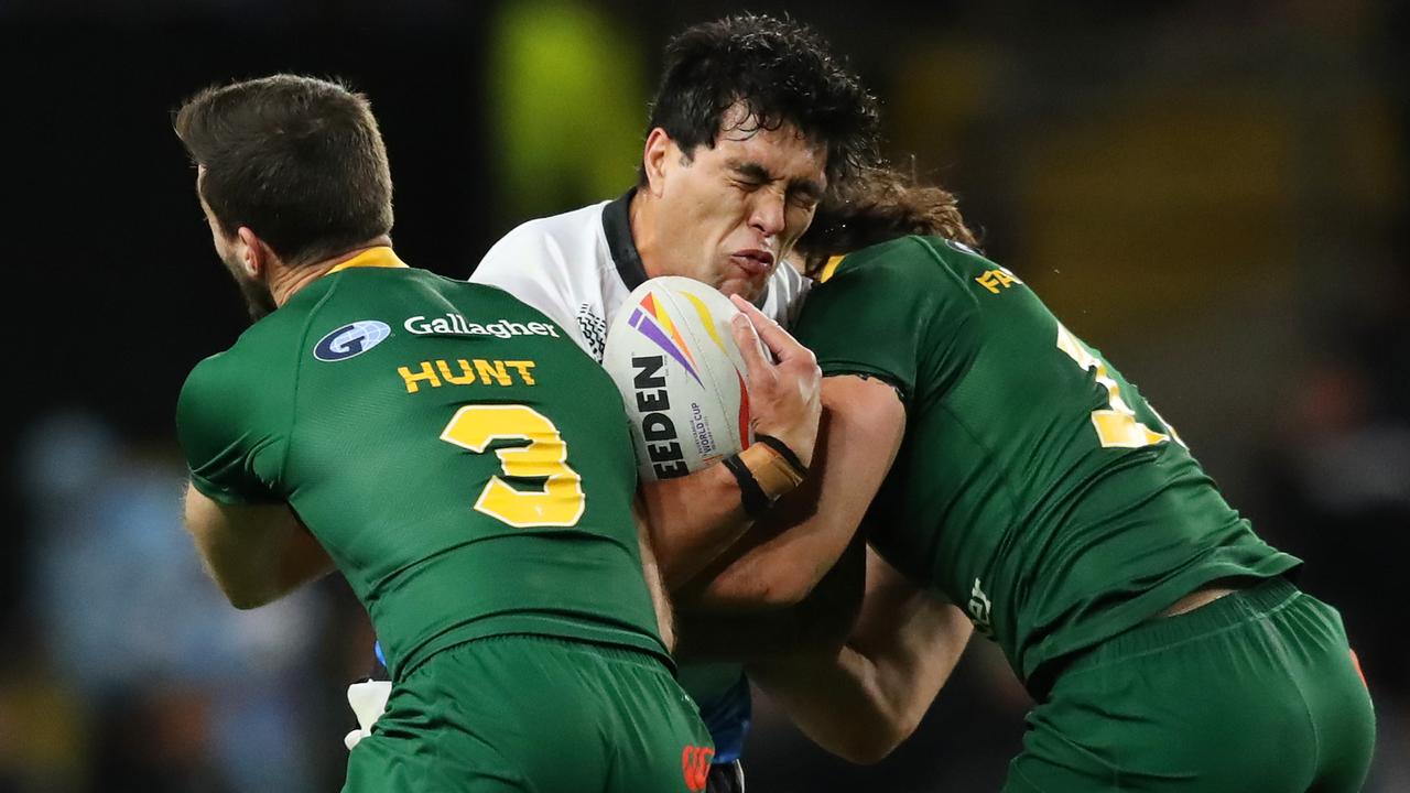 Lamar Manuel-Liolevave of Fiji is tackled by Ben Hunt and Tino Fa'asuamaleaui of Australia. Photo by Jan Kruger/Getty Images for RLWC