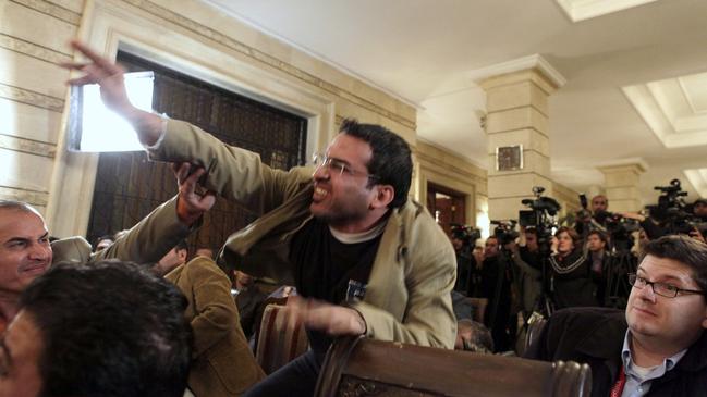 Iraqi journalist Muntadhar al-Zaidi throws a shoe at US president George W. Bush in Baghdad in 2008. Picture: AP / Evan Vucci