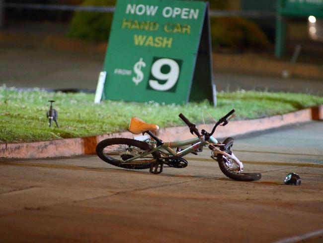 The mangled bike lays on the footpath. Photo: Patrick Herve