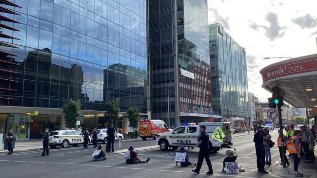 Extinction Rebellion protesters block traffic outside the Santos Building on Flinders Street. Picture: Patrick James